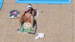 Girl masturbating on beach