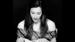 Stoya reading with a vibrator