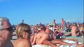 cexus on a nudist beach full of people