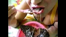 Naughty with mask eating cum on chocolate cake