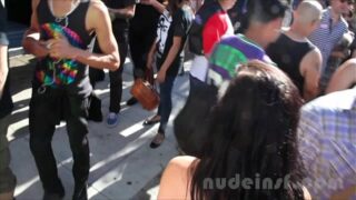 Jaana Linnéa Tervo walking topless in public at Folsom Street Fair infront a group of admirers