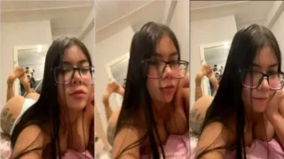 Gabriel Uribe with glasses all cats showing off on the bed